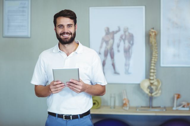 Portrait of physiotherapist holding a digital tablet - Download Free Stock Photos Pikwizard.com