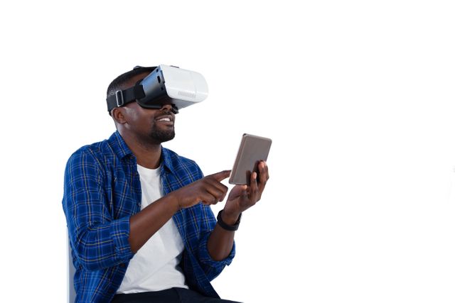 Man using virtual reality headset and digital tablet - Download Free Stock Photos Pikwizard.com