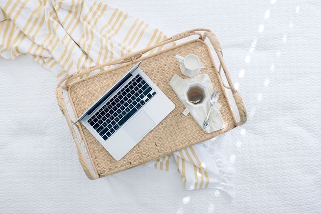 Macbook Beside Coffee Cup on Beige Woven Tray - Download Free Stock Photos Pikwizard.com