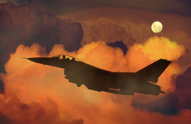Silhouette of Fighter Plane Flying Through Clouds - Download Free Stock Photos Pikwizard.com
