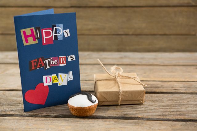 Happy fathers day greeting card with gift box on table - Download Free Stock Photos Pikwizard.com