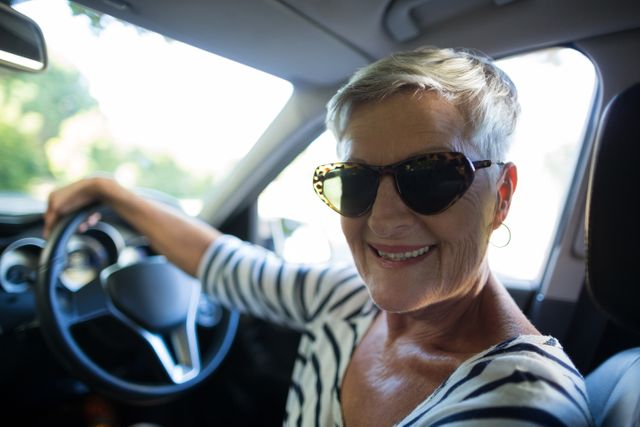 Portrait of senior woman driving car - Download Free Stock Photos Pikwizard.com