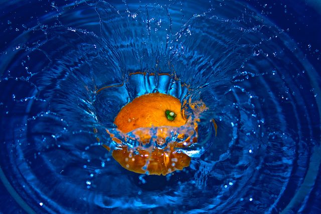 Orange Drop in Water in Time Laps Photography - Download Free Stock Photos Pikwizard.com