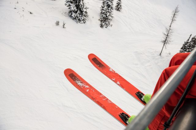 Skier travelling in ski lift - Download Free Stock Photos Pikwizard.com