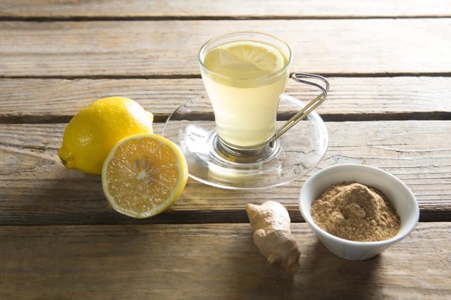 Tea cup with lemon and ginger on wooden table - Download Free Stock Photos Pikwizard.com
