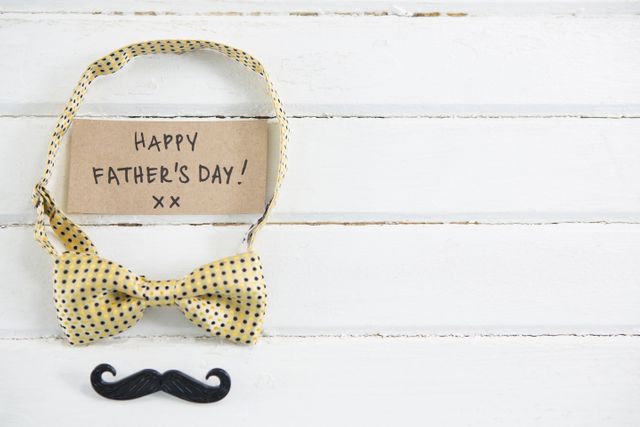 Close up of happy fathers day text with bow tie and mustache - Download Free Stock Photos Pikwizard.com
