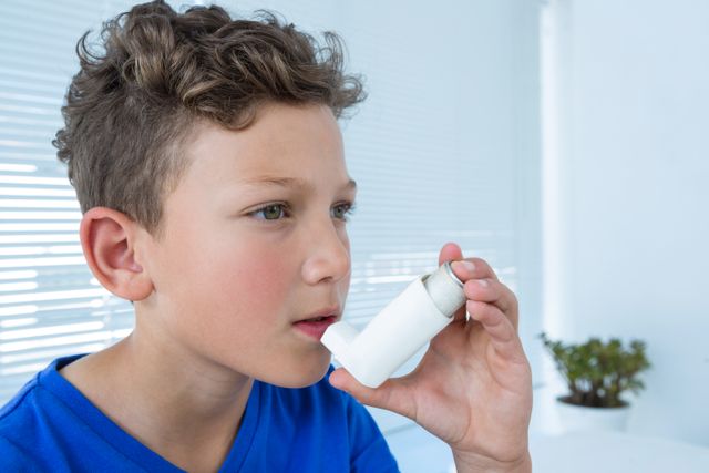 Boy using asthma pump - Download Free Stock Photos Pikwizard.com