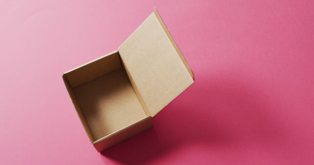Image of open, empty cardboard box and copy space on pink background - Download Free Stock Photos Pikwizard.com