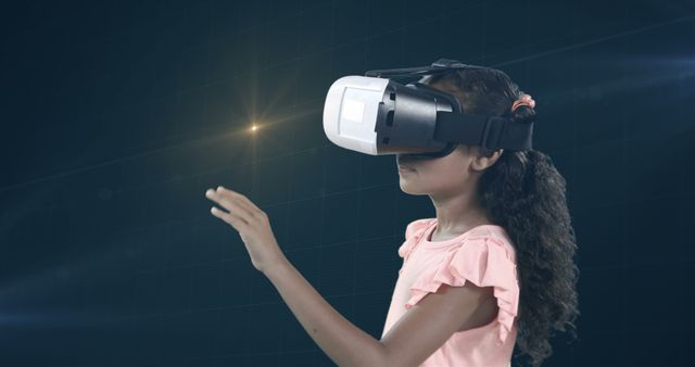 Attentive girl using virtual reality headset and digital screen