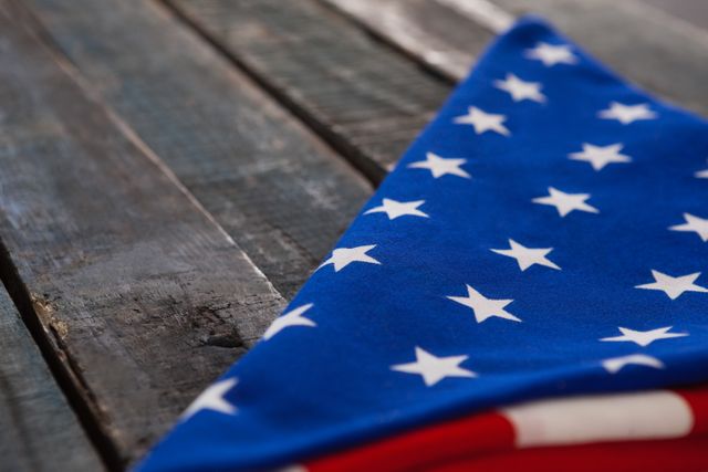 Close-up of folded American flag on wooden table
