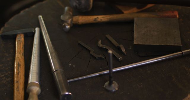 Close up of diverse jeweller tools lying on desk in workshop. independent handmade craft business.