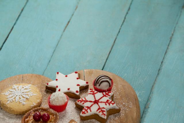 Christmas gingerbread cookies with icing on wooden table