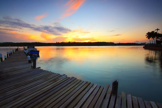 Brown Wooden Dock on Body of Water during Twilight - Download Free Stock Photos Pikwizard.com
