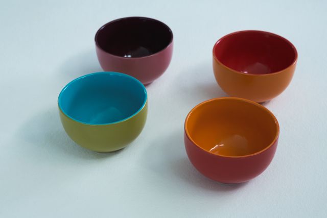 Colorful empty bowls on white background - Download Free Stock Photos Pikwizard.com