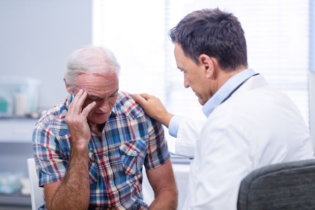 Doctor consoling senior man - Download Free Stock Photos Pikwizard.com