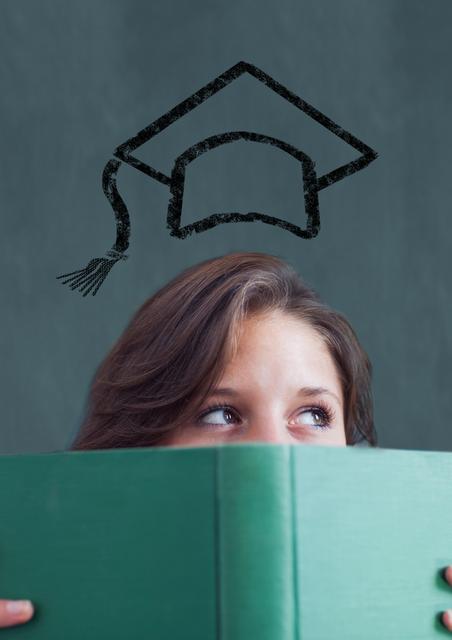 Teenage girl holding book with mortarboard above head - Download Free Stock Photos Pikwizard.com