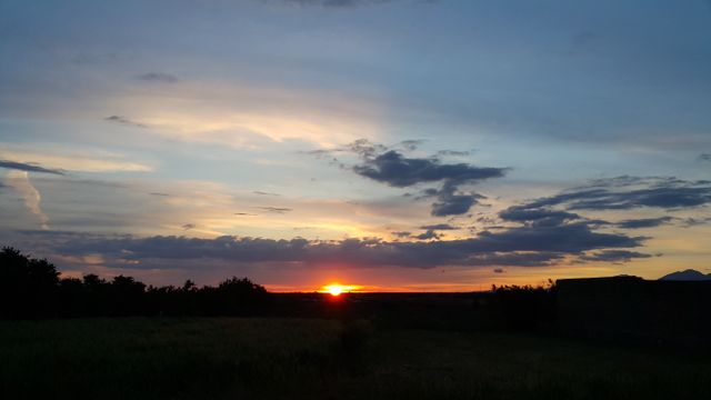 the sunset over a field - Download Free Stock Photos Pikwizard.com