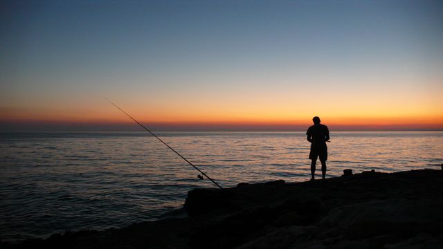 Person Fishing during Sunset - Download Free Stock Photos Pikwizard.com