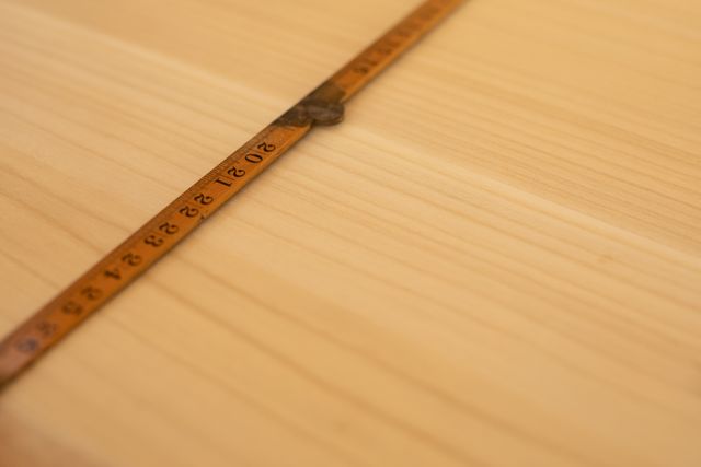 Measure tape on wooden plank - Download Free Stock Photos Pikwizard.com