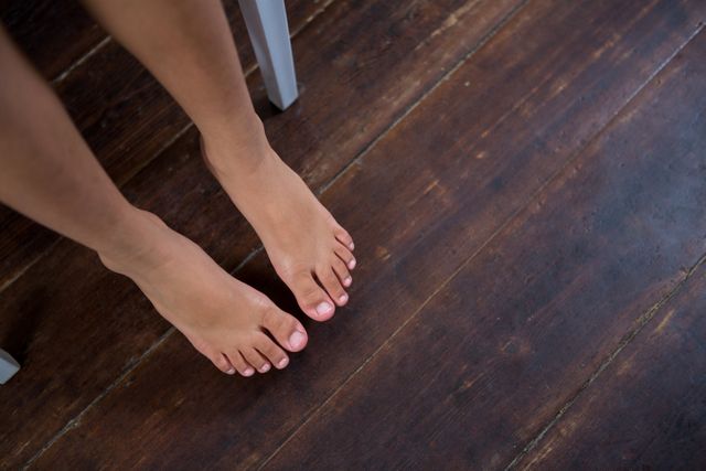 High angle view of girl sitting on chair over hardwood floor - Download Free Stock Photos Pikwizard.com