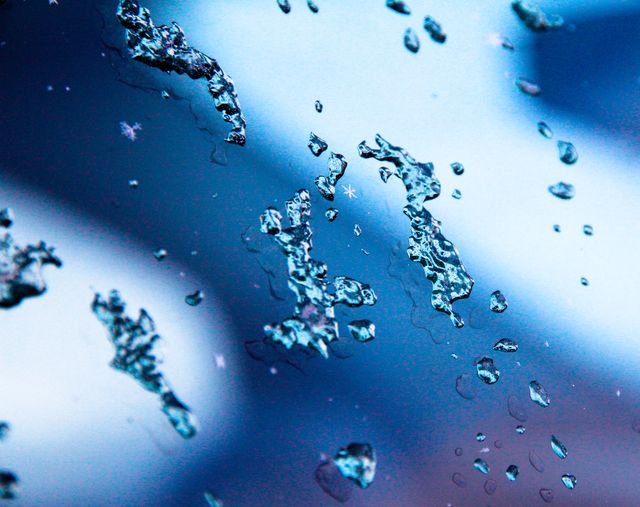 Close up of frozen drops of water on a glass. winter season concept