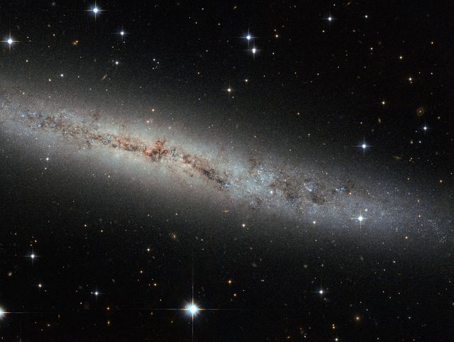Hubble Eyes Galaxy as Flat as a Pancake - Download Free Stock Photos Pikwizard.com