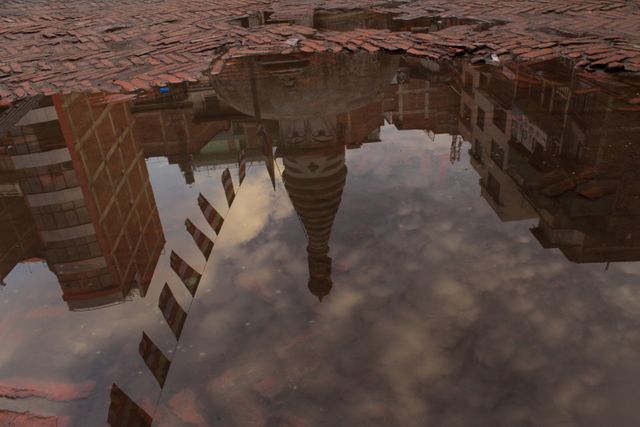 Building in puddle reflection - Download Free Stock Photos Pikwizard.com