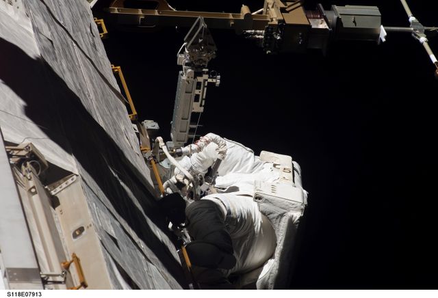 View of Williams working on the OBSS Boom Stand during STS-118 / Expedition 15 EVA - Download Free Stock Photos Pikwizard.com