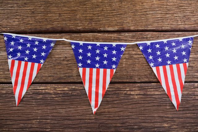Close-up of patriotic bunting arranged on wooden table