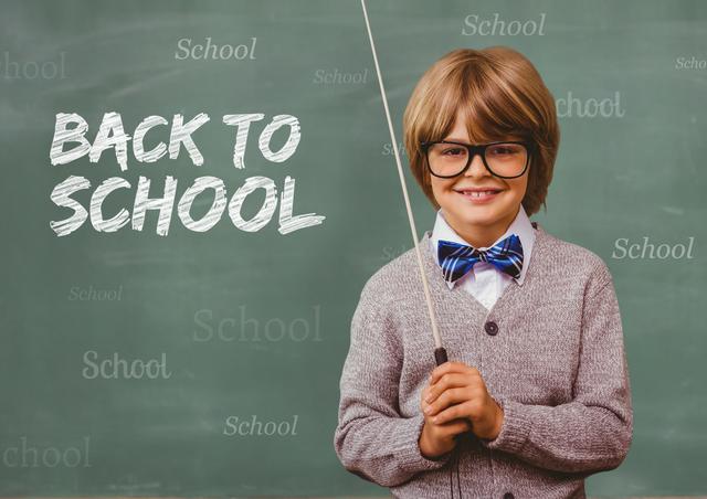 Smiling boy holding a stick with back to school text in background - Download Free Stock Photos Pikwizard.com