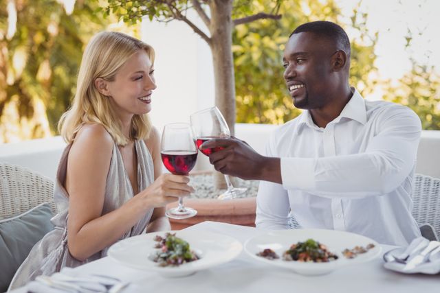 Romantic couple toasting their wine glasses - Download Free Stock Photos Pikwizard.com