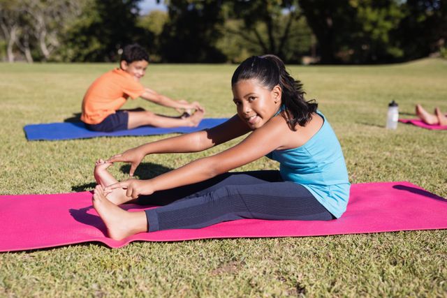 African american mid adult woman practicing yoga during online