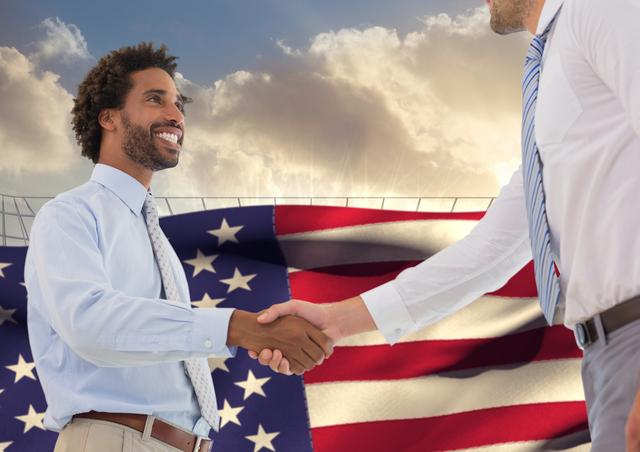 Happy businessmen shaking hands against american flag in the background