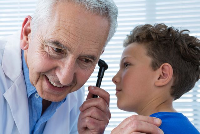 Doctor and patient using otoscope - Download Free Stock Photos Pikwizard.com