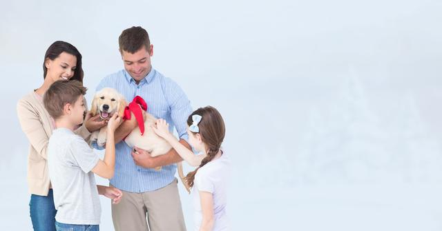 Happy family with dog against blue wall - Download Free Stock Photos Pikwizard.com