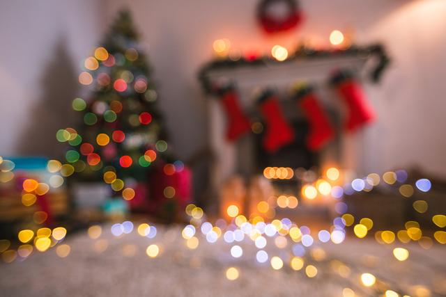 Defocused of christmas tree lights and fireplace - Download Free Stock Photos Pikwizard.com