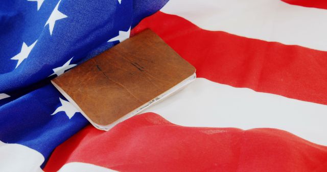 An old book on the American flag evokes patriotism and respect for U.S. heritage. - Download Free Stock Photos Pikwizard.com
