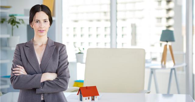 Businesswoman standing with arms crossed - Download Free Stock Photos Pikwizard.com