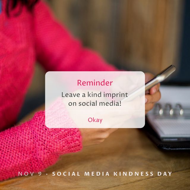 Image of social media kindness day over hands of biracial woman with smartphone. Network, communication and social media concept.