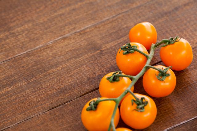 Close-up of cherry tomato on wooden table