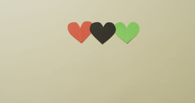 Image of red, black and green paper hearts on beige background - Download Free Stock Photos Pikwizard.com