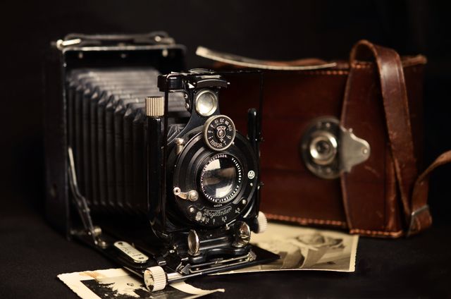 Black Classic Camera Near Brown Leather Bag - Download Free Stock Photos Pikwizard.com