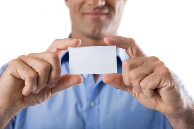Male executive holding a blank business card - Download Free Stock Photos Pikwizard.com