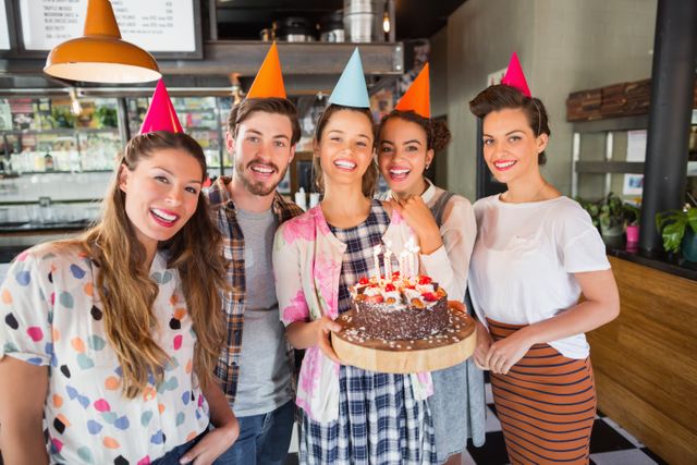 Cheerful friends celebrating birthday at restaurant - Download Free Stock Photos Pikwizard.com