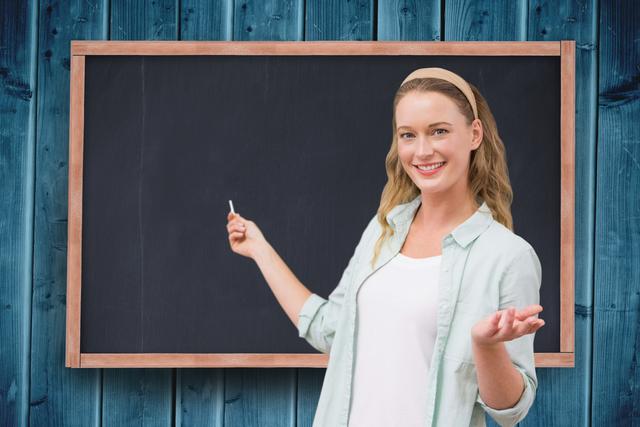 Portrait of woman smiling against blackboard - Download Free Stock Photos Pikwizard.com