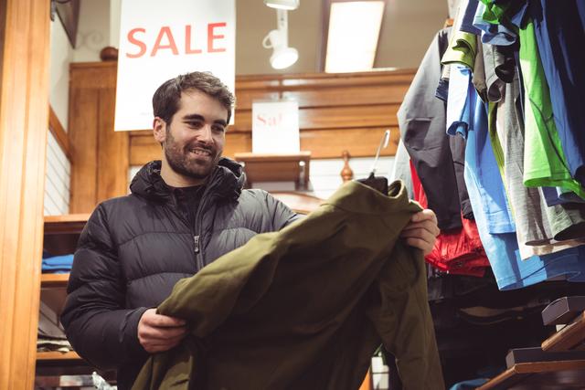 Man shopping in a clothes shop - Download Free Stock Photos Pikwizard.com