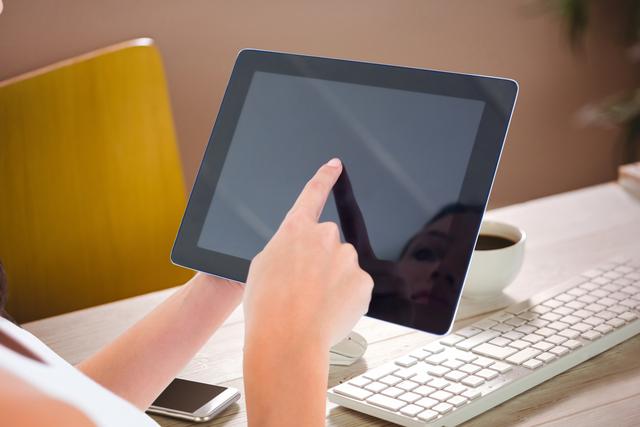 woman pointing at tablet computer of desk background - Download Free Stock Photos Pikwizard.com