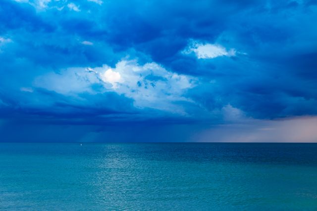 Blue Ocean With Cloudy Sky - Download Free Stock Photos Pikwizard.com