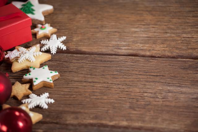 Cookies and christmas decorations on wooden table - Download Free Stock Photos Pikwizard.com