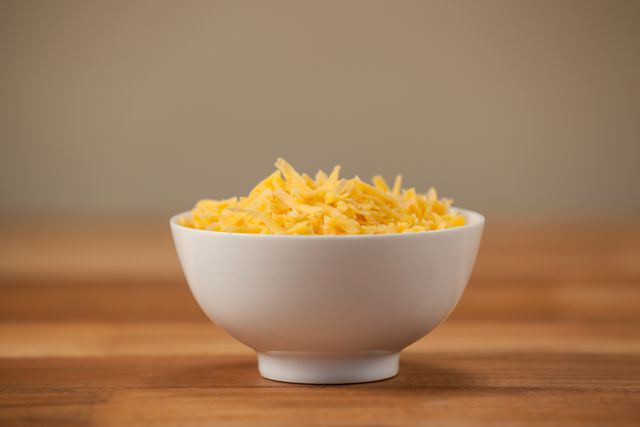 Grated cheese in a bowl - Download Free Stock Photos Pikwizard.com